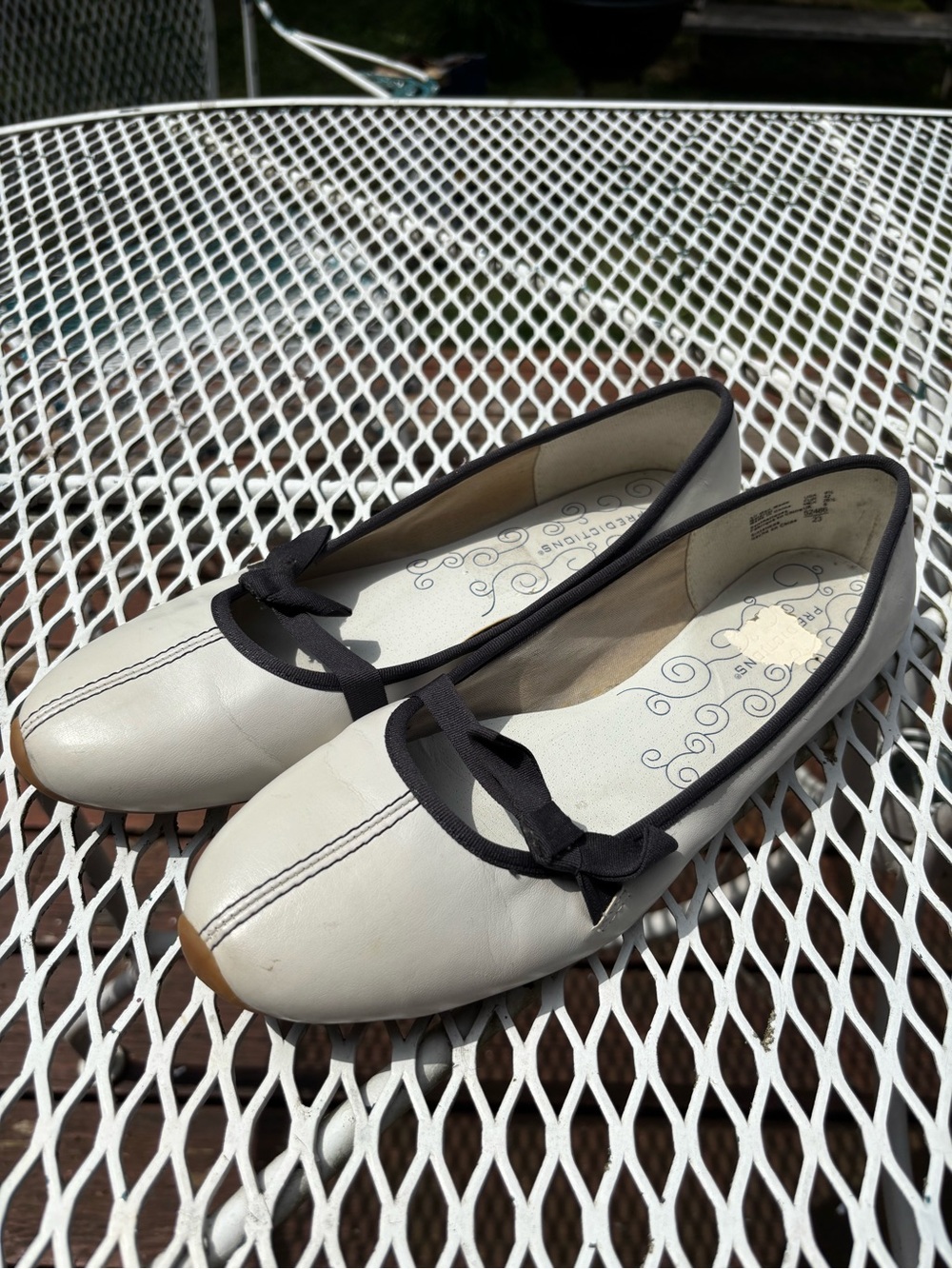 Predictions Cream Ballet Flats with Black Trim and Bow Accent